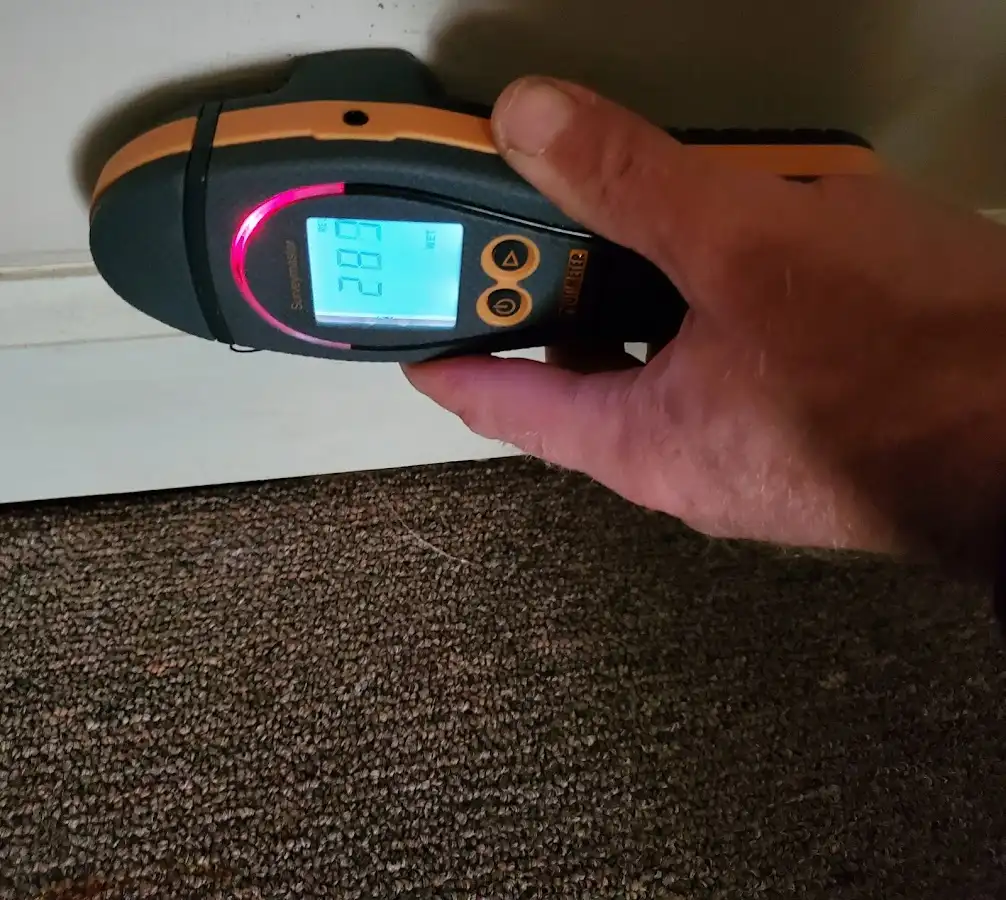 Moisture detection at baseboard during Storm Damage Restoration in San Martin